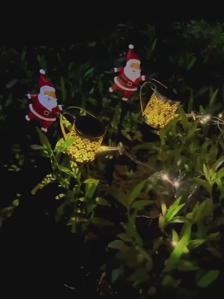 Solare-Laterne „Weihnachtsmann beim Gießen“